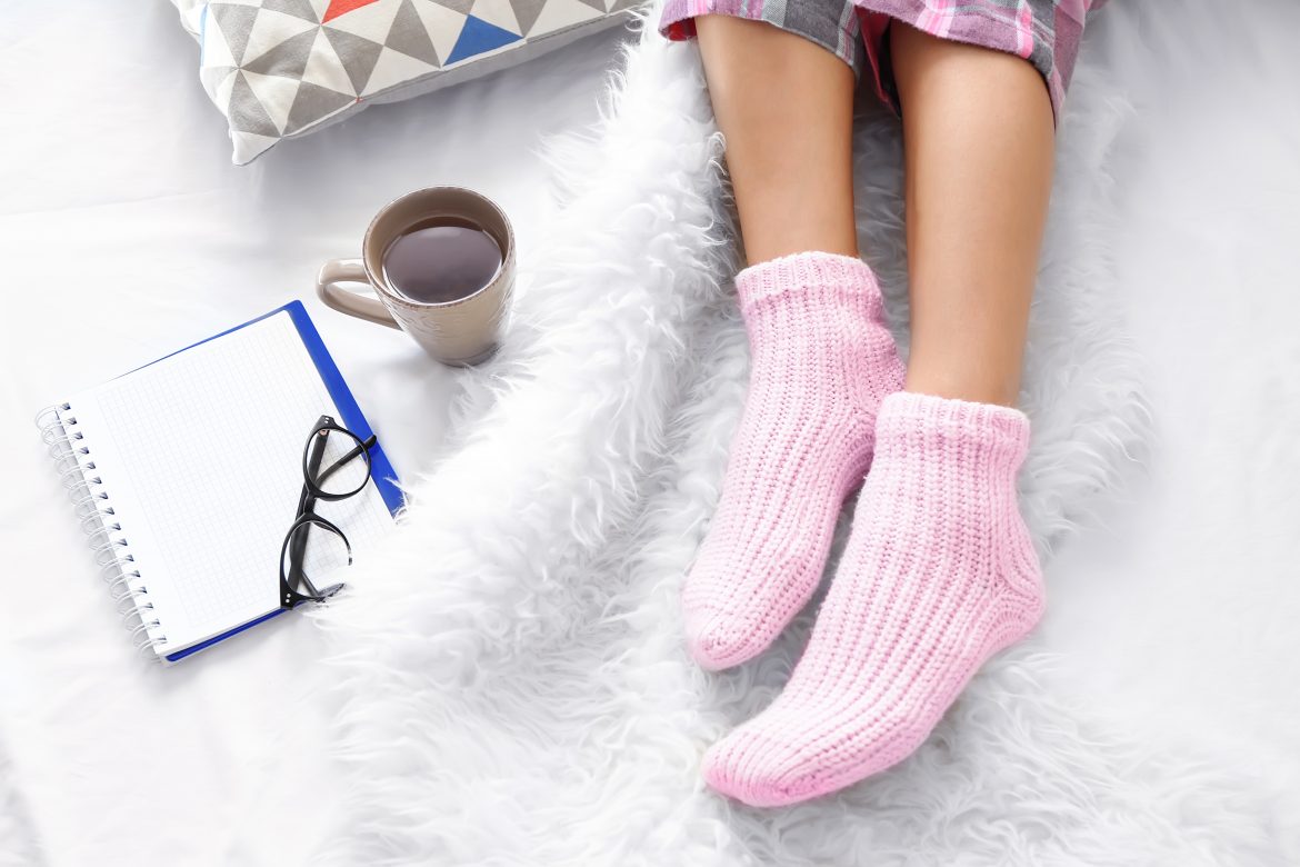 woman's feet in pink socks