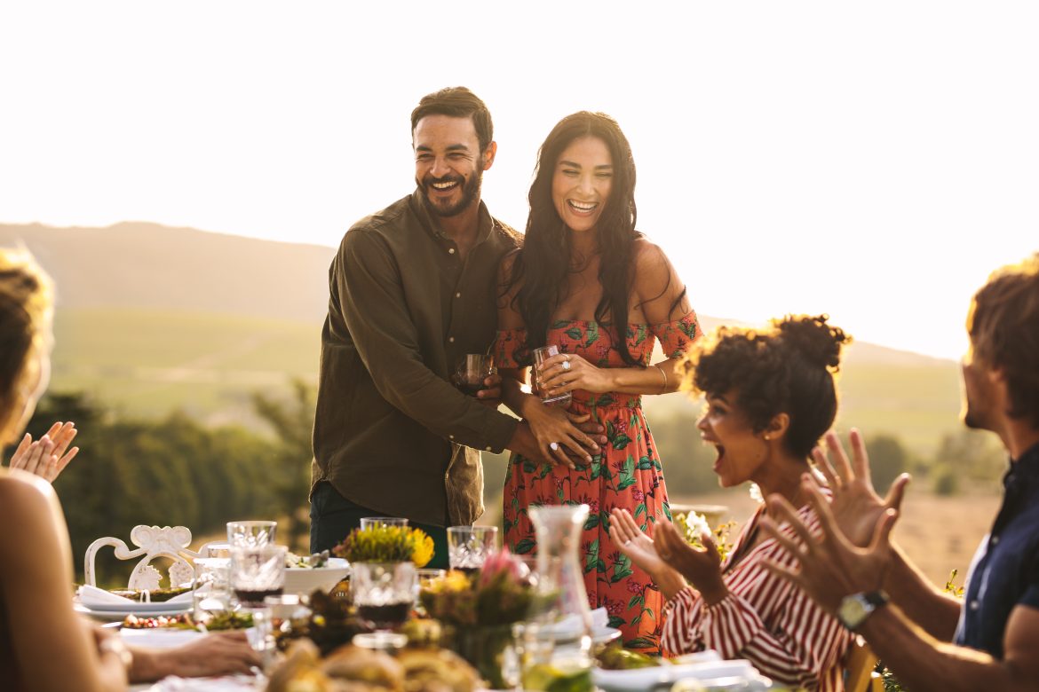 pregnancy announcement ideas_a couple sharing their big news with friends